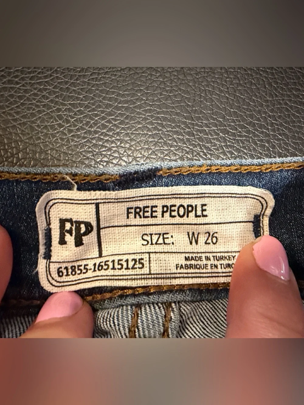 Free People indigo denim jeans with gold stitching